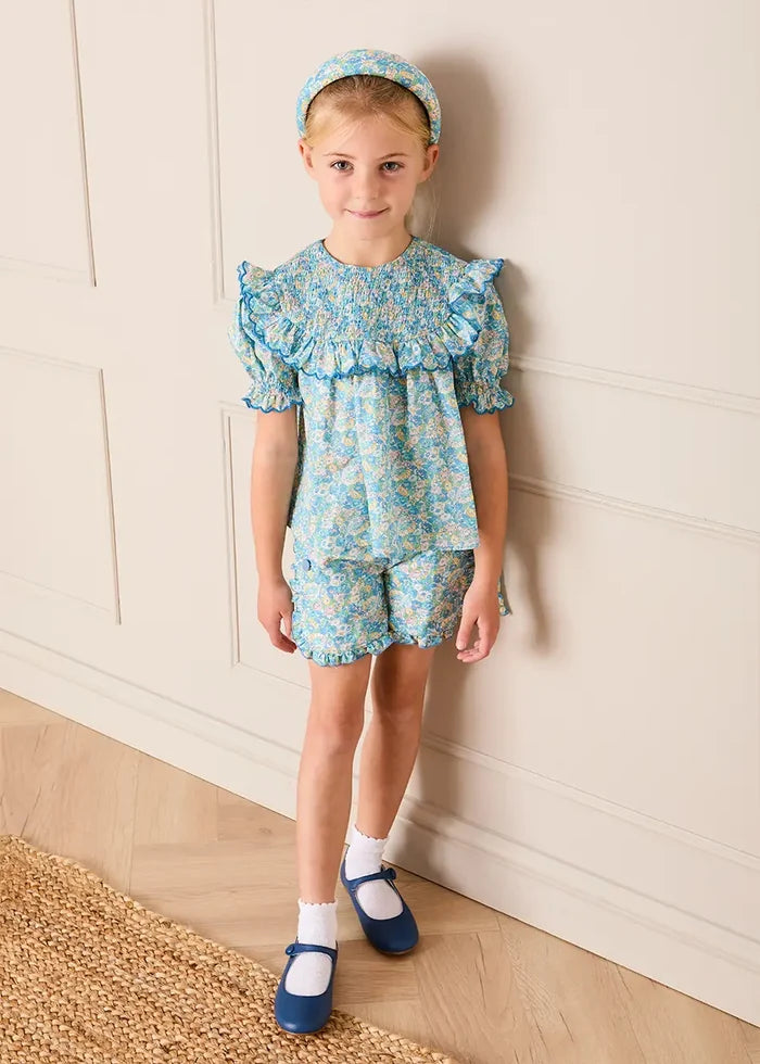 Leontyne Floral Scalloped Smocked Detail Short Sleeve Blouse in Blue Made with Liberty Fabric (2- 10yrs) BLOUSES from Pepa London