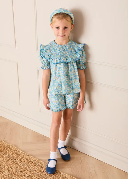 Leontyne Floral Scalloped Smocked Detail Short Sleeve Blouse in Blue Made with Liberty Fabric (2- 10yrs) BLOUSES from Pepa London