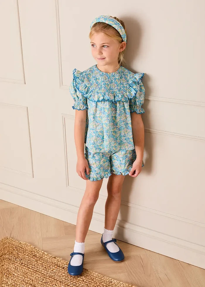 Leontyne Floral Scalloped Smocked Detail Short Sleeve Blouse in Blue Made with Liberty Fabric (2- 10yrs) BLOUSES from Pepa London